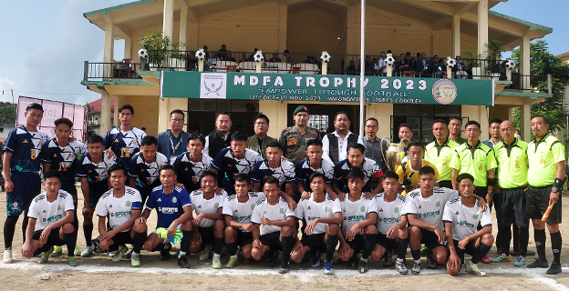 MLA and General Secretary of Nagaland Football Association (NFA), Benei Lamthiu with officials of MDFA, match officials, and players of SSS and KSUM (white) before the kickoff of inaugural match of the  MDFA Trophy 2023 at Imkongmeren Sports Complex, Mokokchung, 17 October. 