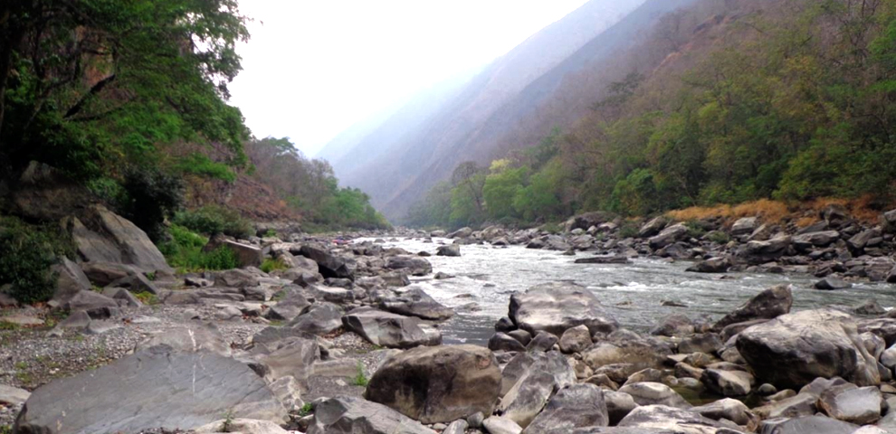 Steep river banks with rock outcrop