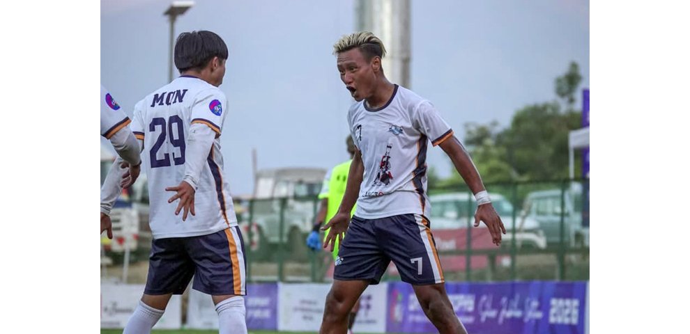 Nokwang Konyak (29) celebrates his goal with teammate Eshong Konyak during Mon’s comeback 3-1 win over Kiphire.