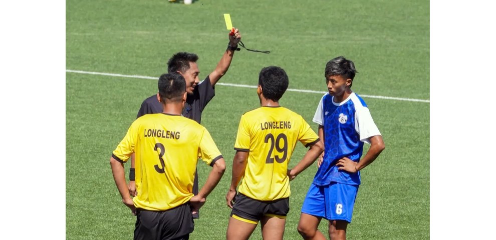 Referee shows a yellow card to Kohima’s Petevizo during their 5–0 victory over Longleng